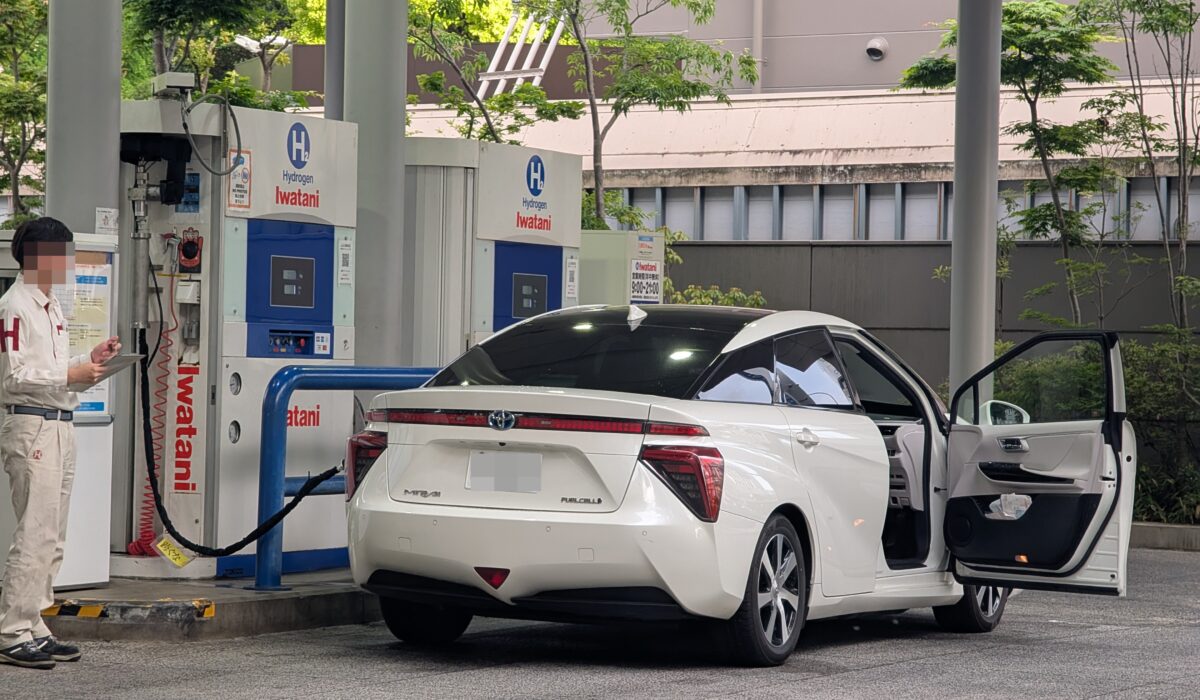 Toyota Mirai car with real users refilling with hydrogen.